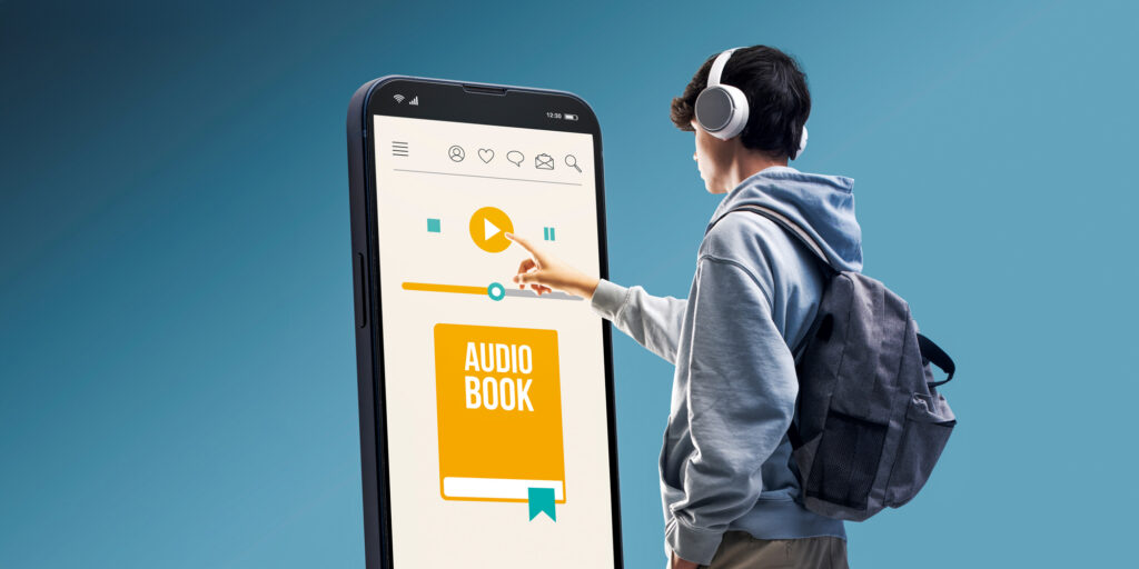 A teen pressing play on an audiobook