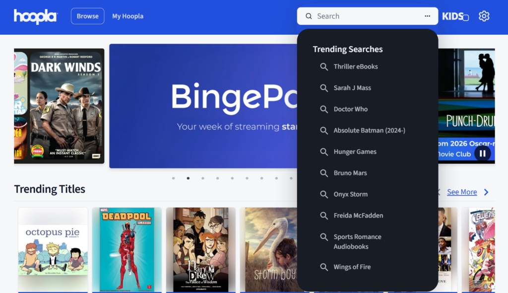 a screenshot of hoopladigital.com showcasing the search bar's drop down of Trending Searches to make it easier to find popular titles right now.