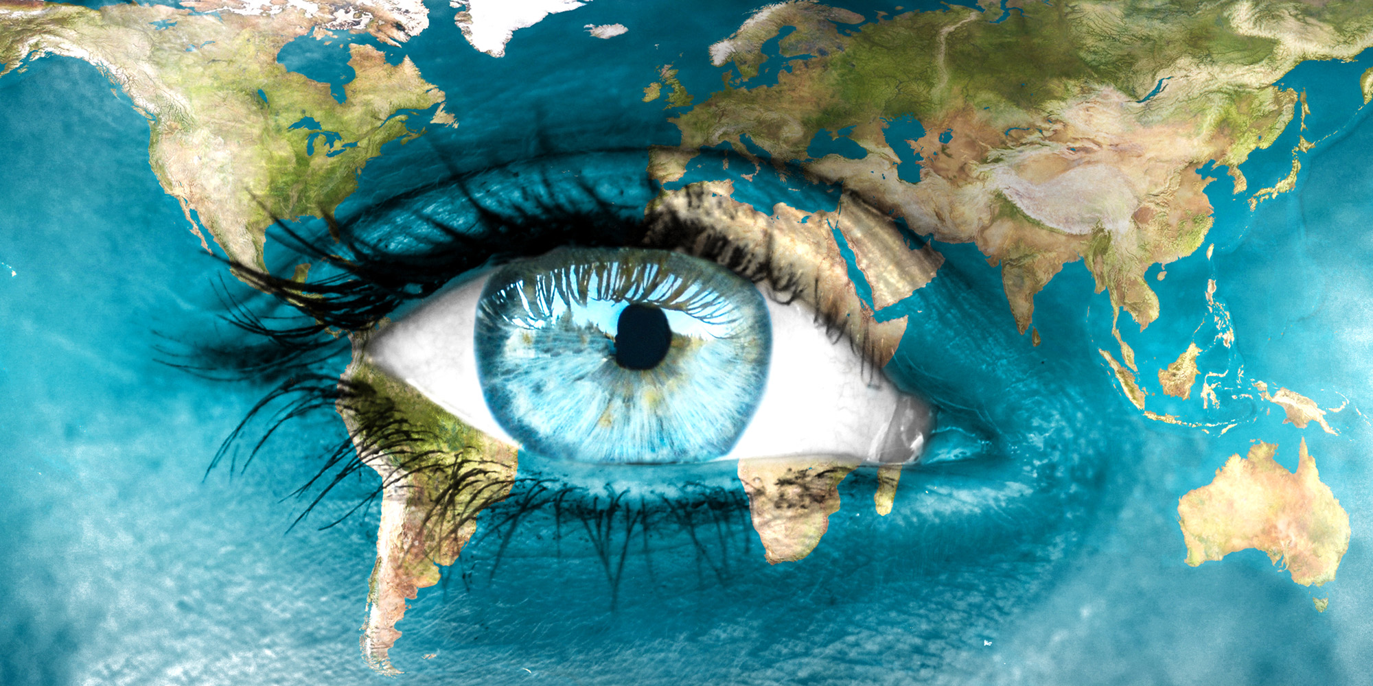 Image of the earth on a womans face and her eye in the center