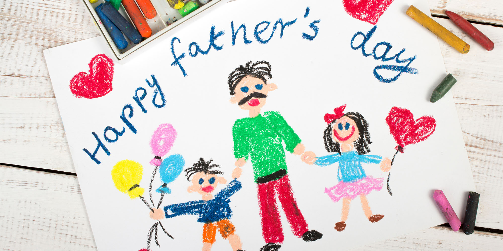 A kid's drawing of his family that says Happy Father's Day